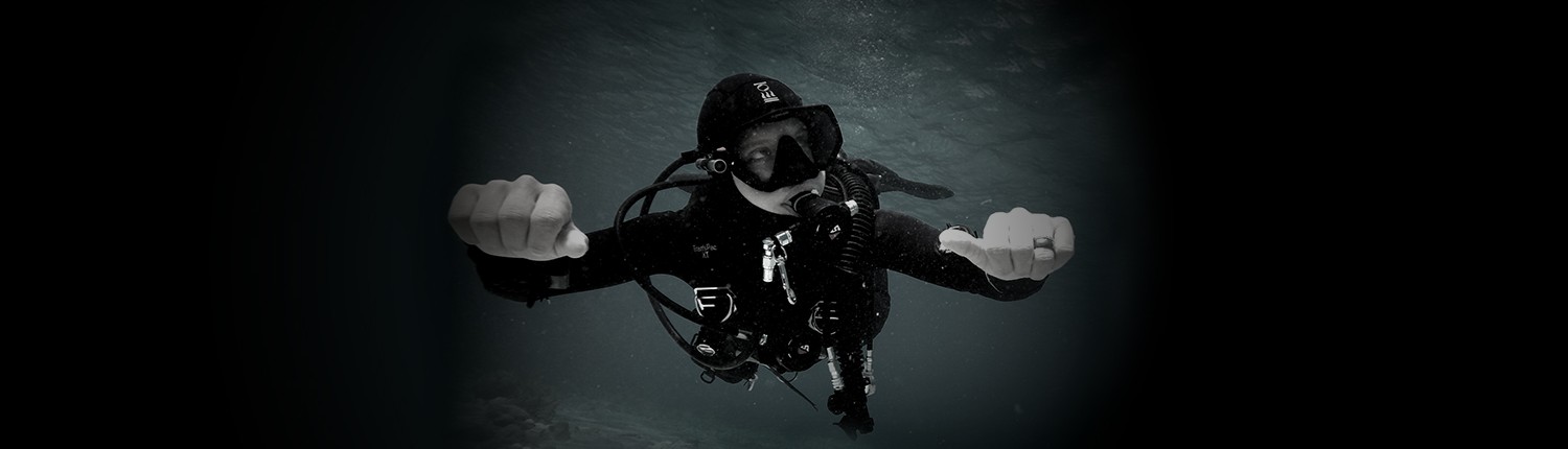 Scuba diver underwater with diving gear